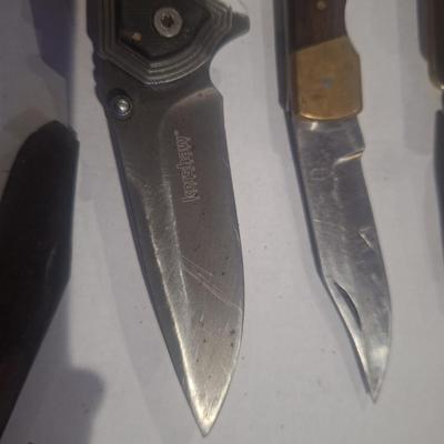 Sale Photo Thumbnail #368: bundle of knives etc  the big old timer is difficult to open and tip broken off.