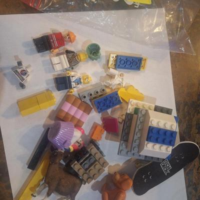 Sale Photo Thumbnail #395: Lego pieces with a couple of minifigs