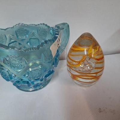 Sale Photo Thumbnail #550: glass paperweight and small glass pitcher.  The egg shaped paperweight has been dropped and has a small spot on it's side, see all photos.