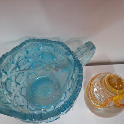 Sale Photo Thumbnail #551: glass paperweight and small glass pitcher.  The egg shaped paperweight has been dropped and has a small spot on it's side, see all photos.