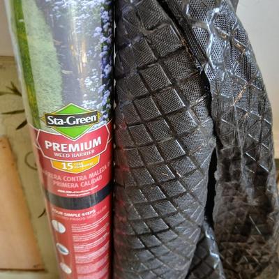 Two rolls of landscape fabric, ceramic pot, wooden frame and more