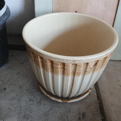 Two rolls of landscape fabric, ceramic pot, wooden frame and more