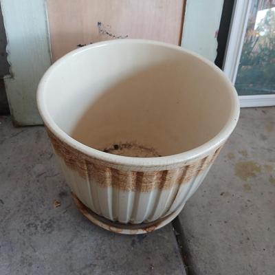 Two rolls of landscape fabric, ceramic pot, wooden frame and more