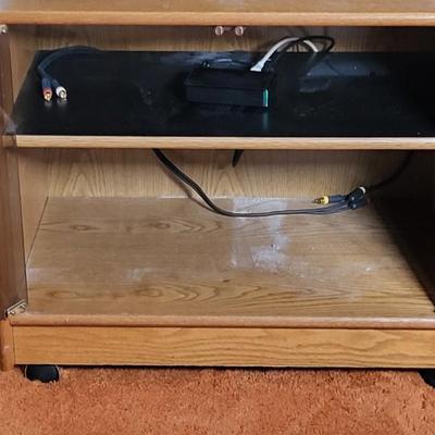 LOT 11B: Sony 32" TV and Remote with Glass Door Two Shelf Stand on Wheels