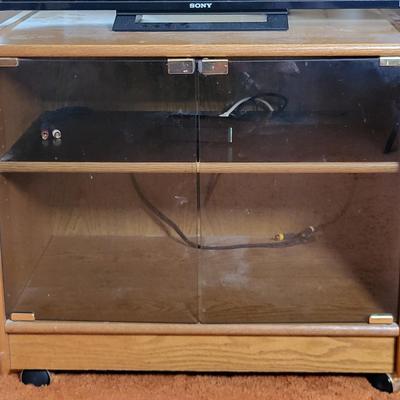 LOT 11B: Sony 32" TV and Remote with Glass Door Two Shelf Stand on Wheels