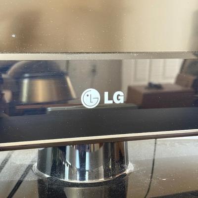 LOT 44F: LG 42" Television Model 42LD220-UA w/ Media Stand