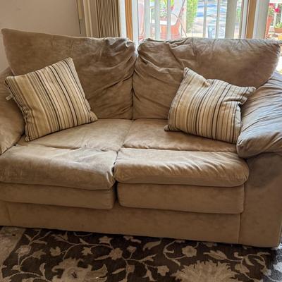 LOT 48F: Pair of Loveseats w/ Decorative Pillows & Rolling Ottoman