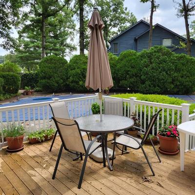 LOT 155P: Glass Round Patio Table with Four Chairs and Unfolding Umbrella