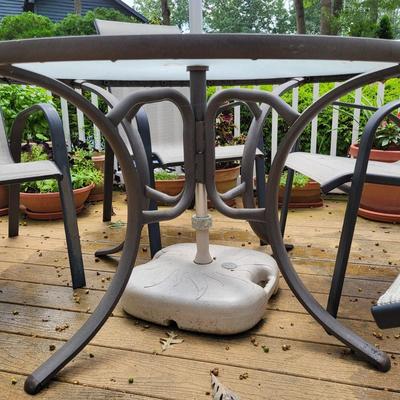LOT 155P: Glass Round Patio Table with Four Chairs and Unfolding Umbrella