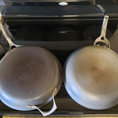 LOT 225K: Large Assortment of Pots and Pans; Cuisinart, Calphalon, and More