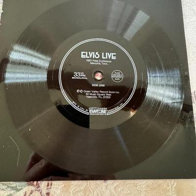 Sale Photo Thumbnail #521: Condition - Like New

The image shows a flexi-disc record of Elvis Presley - Elvis Live: 1961 Press Conference Memphis, Tenn.. 
Here's some information about this recording:
Content: This is an interview or press conference recording of Elvis Presley from