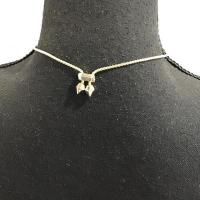 Sale Photo Thumbnail #92: Gold tone, slider, necklace, and pendant with mother pearl. Please see attached photos.