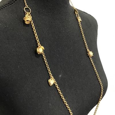 Sale Photo Thumbnail #141: Beautiful vintage, goldtone Stella, and dot fashion necklace with charms. Please see attached photos.