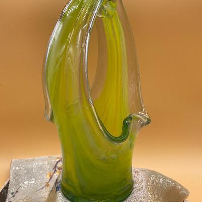 Sale Photo Thumbnail #294: Beautiful pale green blown glass vase in a basket style, no makers mark.  
9.5 x 4 inches