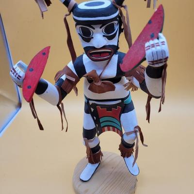 Sale Photo Thumbnail #298: Artist = Largo     Beautiful Clown Kachina with leather accents.
14.5 inches tall.  Retails at $350 to  $900
Noted Largo artists include Francis Largo, Gary Largo, N. Largo and M.E. Largo
The Clown Kachina is a significant figure in Native American cultur