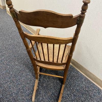 Sale Photo Thumbnail #329: This is a real treasure, there is so much charm and character here.  
Child or Junior Oak and brass rocking chair.  Leather seat.
One rocker has been expertly repaired with brass.  see photo 
34.5 inches tall, 17.75 inches wide.
The seat is 15.5 x 14 inch