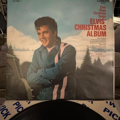 Sale Photo Thumbnail #135: The image is of Elvis' Christmas Album on vinyl, released by RCA Camden, catalog number CAL-2428. It shows Elvis Presley against a snowy backdrop, with the title "Elvis' Christmas Album". 
The album includes these Christmas songs:
"Blue Christmas"
"Silent