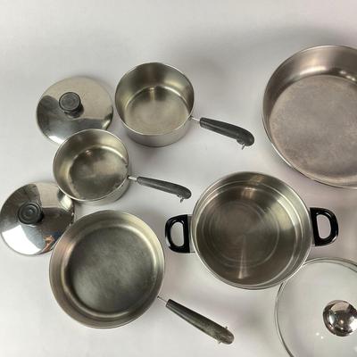 063 Large Lot of Assorted Revereware Cooking Pans & Pots With Matching Lids