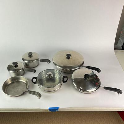 063 Large Lot of Assorted Revereware Cooking Pans & Pots With Matching Lids