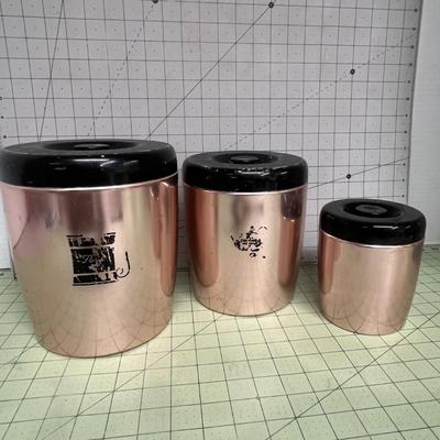 Sale Photo Thumbnail #90: Set of 3 copper-tone canister with glossy black plastic lids.