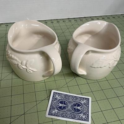 Sale Photo Thumbnail #172: Set of 2 Ceramic Pitchers with Embossed Olive Branch Design.