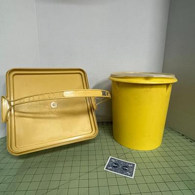 Sale Photo Thumbnail #190: Round Yellow Storage bin and a square lid with an integrated carry handle.
