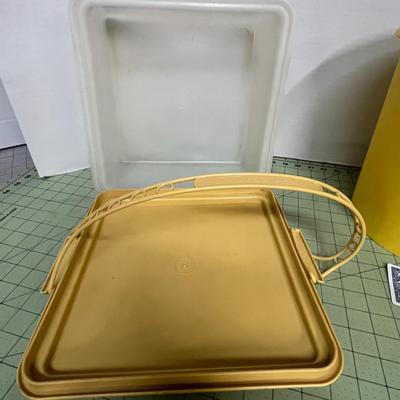 Sale Photo Thumbnail #192: Round Yellow Storage bin and a square lid with an integrated carry handle.