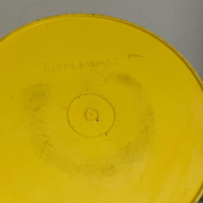 Sale Photo Thumbnail #194: Round Yellow Storage bin and a square lid with an integrated carry handle.