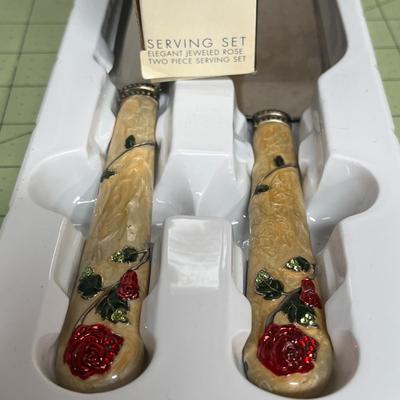 Sale Photo Thumbnail #302: Elegant Floral Handles Embellished with Red Rose Accents.