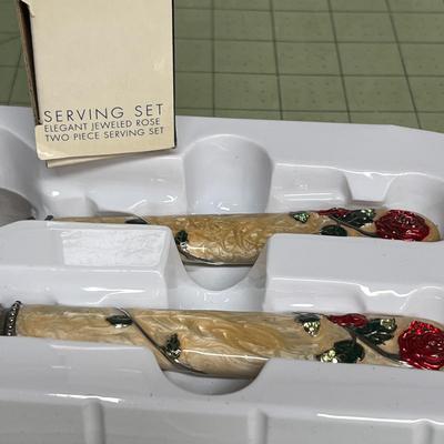Sale Photo Thumbnail #301: Elegant Floral Handles Embellished with Red Rose Accents.