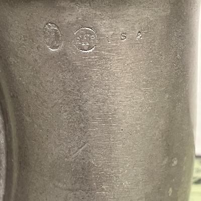 Sale Photo Thumbnail #365: Curved, Integrated Handle Shaped like a stylized horn or tusk.