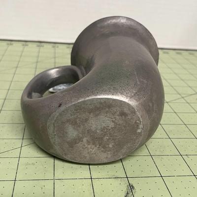 Sale Photo Thumbnail #366: Curved, Integrated Handle Shaped like a stylized horn or tusk.