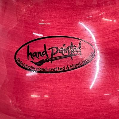 Sale Photo Thumbnail #396: Red ceramic pitcher with classic round-bellied shape.