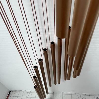 Sale Photo Thumbnail #749: Hanging chime, soothing tones, durable wood, metal construction, decorative.