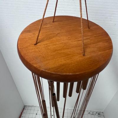 Sale Photo Thumbnail #750: Hanging chime, soothing tones, durable wood, metal construction, decorative.