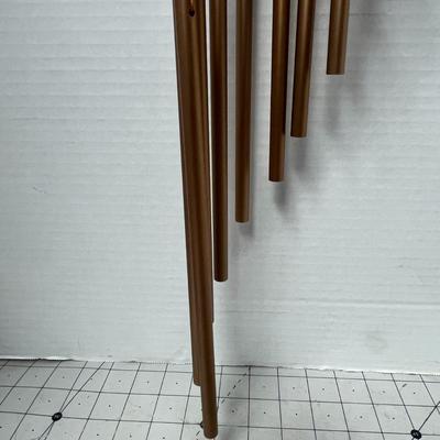 Sale Photo Thumbnail #748: Hanging chime, soothing tones, durable wood, metal construction, decorative.