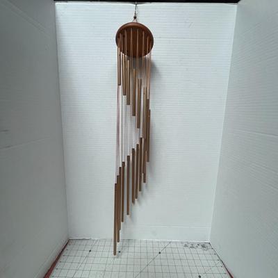 Sale Photo Thumbnail #747: Hanging chime, soothing tones, durable wood, metal construction, decorative.
