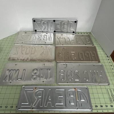 Sale Photo Thumbnail #772: Collection of 8 assorted vintage license plates, mixed states, metal.
