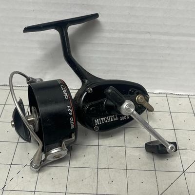 Sale Photo Thumbnail #826: Two vintage Mitchell spinning reels, durable graphite carbon spool design.