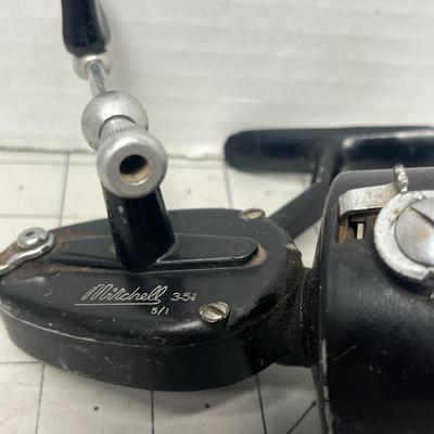 Sale Photo Thumbnail #828: Two vintage Mitchell spinning reels, durable graphite carbon spool design.