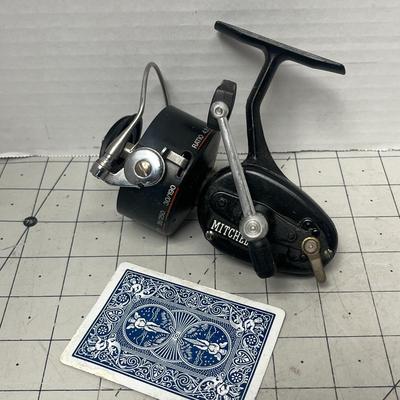 Sale Photo Thumbnail #823: Two vintage Mitchell spinning reels, durable graphite carbon spool design.