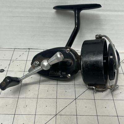 Sale Photo Thumbnail #827: Two vintage Mitchell spinning reels, durable graphite carbon spool design.