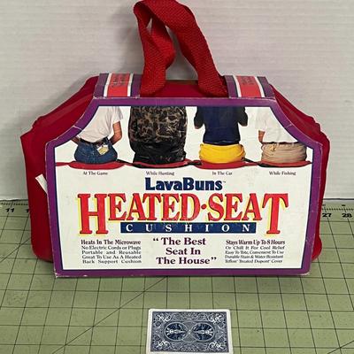 Sale Photo Thumbnail #832: Portable microwaveable cushion keeps seats warm for hours outdoors.