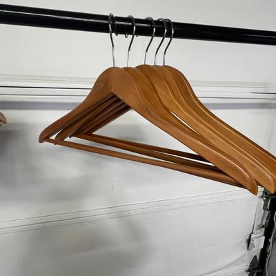 Sale Photo Thumbnail #837: Sturdy wood hangers for clothes, smooth finish, durable design.