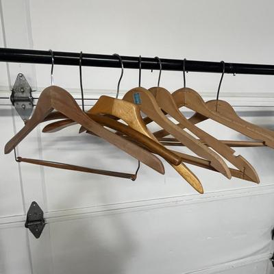 Sale Photo Thumbnail #839: Sturdy wood hangers for clothes, smooth finish, durable design.