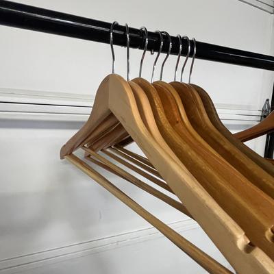 Sale Photo Thumbnail #838: Sturdy wood hangers for clothes, smooth finish, durable design.