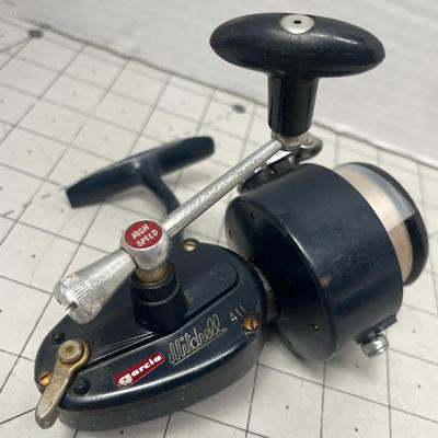 Sale Photo Thumbnail #852: Two vintage Mitchell 300 reels with StrikeForce reel bag and Pflueger split shot sinkers tin.