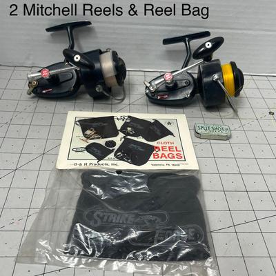 Sale Photo Thumbnail #848: Two vintage Mitchell 300 reels with StrikeForce reel bag and Pflueger split shot sinkers tin.