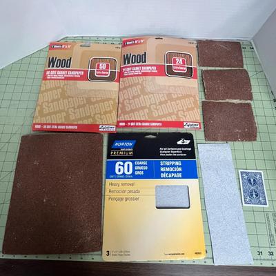 Sale Photo Thumbnail #894: Complete painting kit with sandpaper, rollers, scrapers, and lacquer thinner.