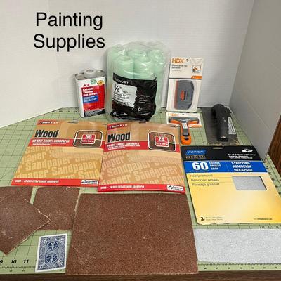 Sale Photo Thumbnail #893: Complete painting kit with sandpaper, rollers, scrapers, and lacquer thinner.